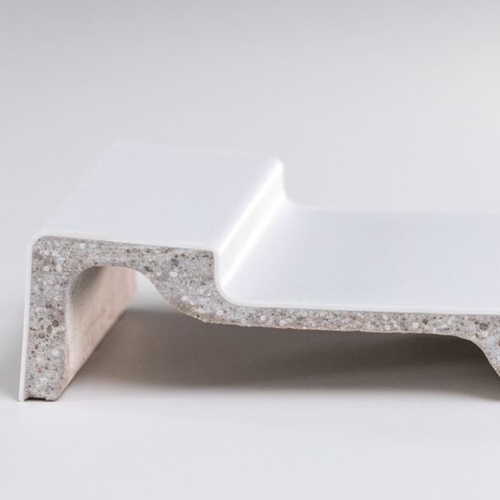 Close-up of L-shaped white ABS acrylic shower tray with speckled inner texture and smooth polished finish