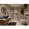 Stylish bathroom interior displaying a white sink on a wooden counter, highlighting modern design elements