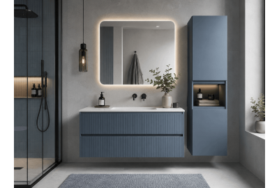 Blue bathroom vanity with illuminated mirror, wall-mounted storage cabinet, pendant lighting, and glass shower enclosure.