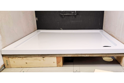 Low profile shower tray being fitted 